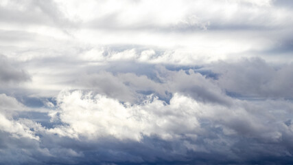 Gray dramatic sky with dark and light rain clouds