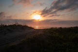 Fototapeta Perspektywa 3d - sunset on the beach colorful clouds