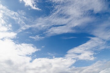 Wall Mural - White cirrocumulus clouds in the blue sky. Beautiful sky background