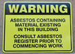 Warning about asbestos existing in the building signage.