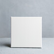 © meteoritka - Blank square canvas in grey room. Mockup poster frame.