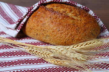 Wholegrain bread loaf and dried wheat bunch