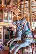 © Gillian Vann/Stocksy - vintage looking carousel with horses