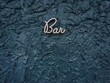 © B. Harvey/Stocksy - Beautiful 'Bar' Sign on Textured Wall