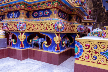 the art and decoration just below the golden statue of buddha at buddha park, swayambhunath, kathman