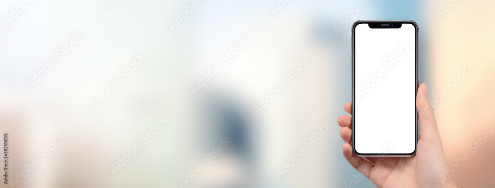 街中でスマートフォンを持っている女性の手の画像合成用素材 Wall Mural Hanahal