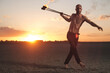 © Brkati Krokodil/Stocksy - Man Fire Juggling In The Desert