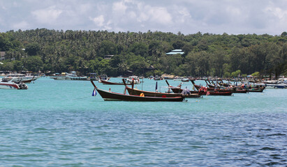 Wall Mural - Idyllic crystal seawater in front of luxury hotel, attractive clear sea, nature coastline backgrounds during holidays, wave from clear blue green sea and fine sand Phuket Thailand toursim advertisemen