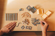 © MyMicrostock/Stocksy - Closeup View of Woman Hands Assembling Wooden Furniture at Home