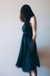 © Jacqui Miller/Stocksy - Side view of unrecognisable woman wearing an old fashioned flowing black dress