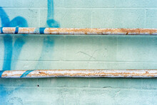 Urban Details With Rusty Pipes And Blue Painted Wall