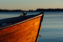 Wooden Boat Against A Blue Lake