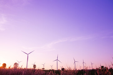 Wind generator among nature background concept of green wolrd energy vintage tone sunset