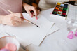 © Sergey Filimonov/Stocksy - Woman prepare blank paper for painting