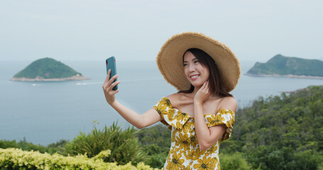 Poster - Travel woman take selfie on cellphone at countryside