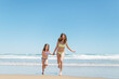 © MyMicrostock/Stocksy - Little Sisters Running at the Beach