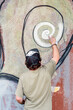 © Pixel Stories/Stocksy - Male graffiti artist writing on wall