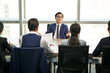 © imtmphoto - young asian job candidate talking big during a group interview