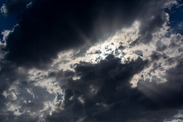 Wall Mural - rays of light reflected through the clouds