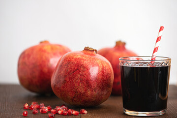 Wall Mural - Fresh ripe pomegranate and juice in the glass. Close up