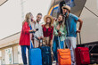 © Davide Angelini - Multiracial group of people walking at train station. Travel, holiday and vacation new normal concept