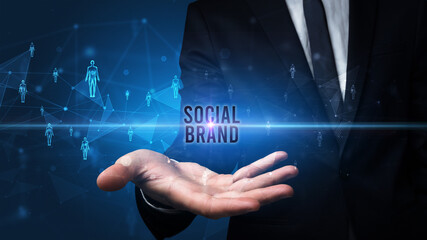 Elegant hand holding SOCIAL BRAND inscription, social networking concept