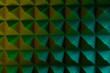 Abstract pyramid background in colored light.