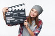© paffy - Smiling teen girl holding clap board