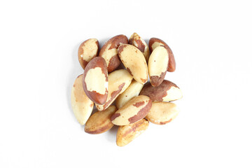 Pile of brazil nuts isolated on white background. Delicious treat delicacy