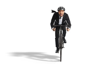 Sticker - Young businessman in a suit riding a bicycle towards the camera