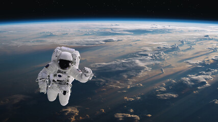 Wall Mural - astronaut walking in space with earth background. elements of this image furnished by nasa