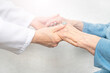 © Dmytro - Helping and care for the elderly concept.Young nurse hands holding an old hands of senior woman.