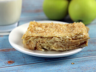 slice of puff pastry cake on a plate, napoleon cake