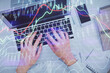 © peshkova - Double exposure of woman hands working on computer and forex chart hologram drawing. Top View. Financial analysis concept.
