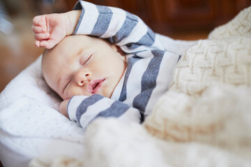 Wall Mural - Adorable baby girl sleeping in the crib