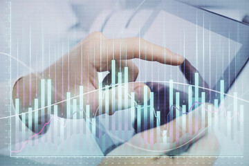 Multi exposure of man's hands holding and using a phone and financial chart drawing. Market analysis concept.