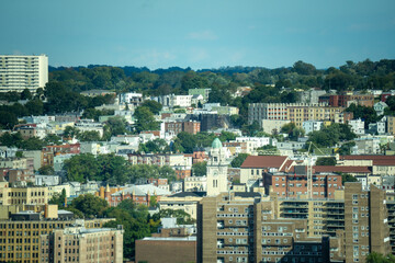 Yonkers, NY / United States - Oct. 6, 2020: a view of Yonker's skyline; apartments, businesses, city hall and churches.