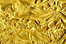 Gold Shiny Wall Abstract Background. Crumpled Luxury Metallic Foil Texture.