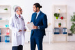 © Elnur - Male doctor and businessman discussing medical project
