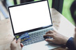 © Somkiat - Man using blank laptop and credit card sending massages shopping online.