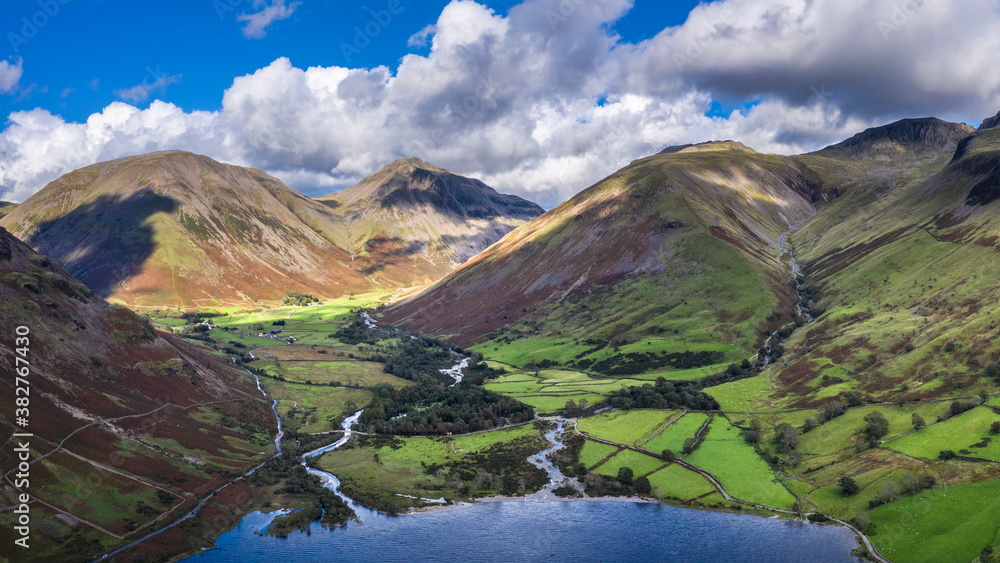 Beautiful drone view over Lake District landscape in late Summer, in Wast Water valley with mountain views and dramatic sky - obrazy, fototapety, plakaty 