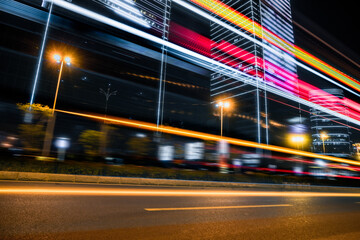 light trails in the downtown district, china.