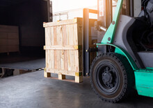 Cargo Shipment, Freight Truck, Warehousing And Delivery Service. Forklift Loading Crate Wooden Into Cargo Container Truck. Logistics And Transportation