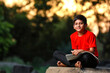 © PRASANNAPIX - Indian / Asian school boy with note book and studying at home