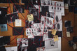 © New Africa - Detective board with fingerprints, crime scene photos and red threads
