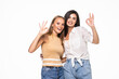 © F8  \ Suport Ukraine - Happy two women showing okay gesture, isolated over white background