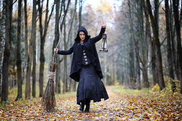 Wall Mural - A woman in a witch suit in a forest