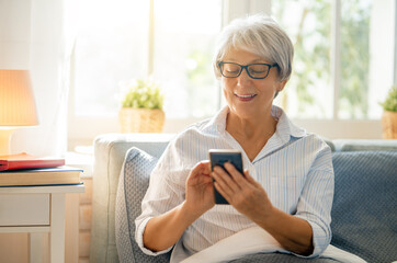 Sticker - senior woman is using smartphone