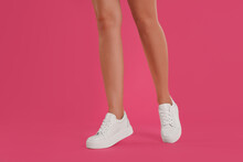 Woman Wearing Shoes On Pink Background, Closeup