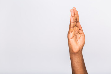 Wall Mural - African american black man hand hanging something blank isolated on a white background. Close-up.